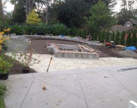 Landscaping with plants, bushes and retaining wall in Victoria BC