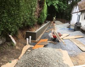 Retaining wall being stripped of forms in Victoria BC